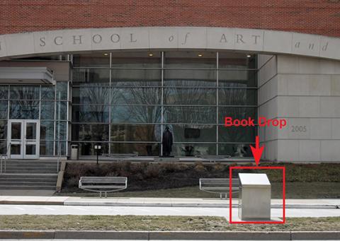 Book drop located in front of the Herron Library